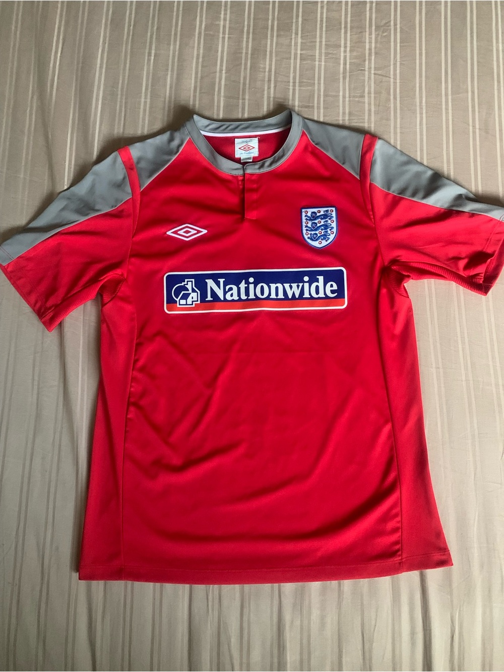 Umbro Red Soccer Jersey with Gray Accents and Nationwide Logo